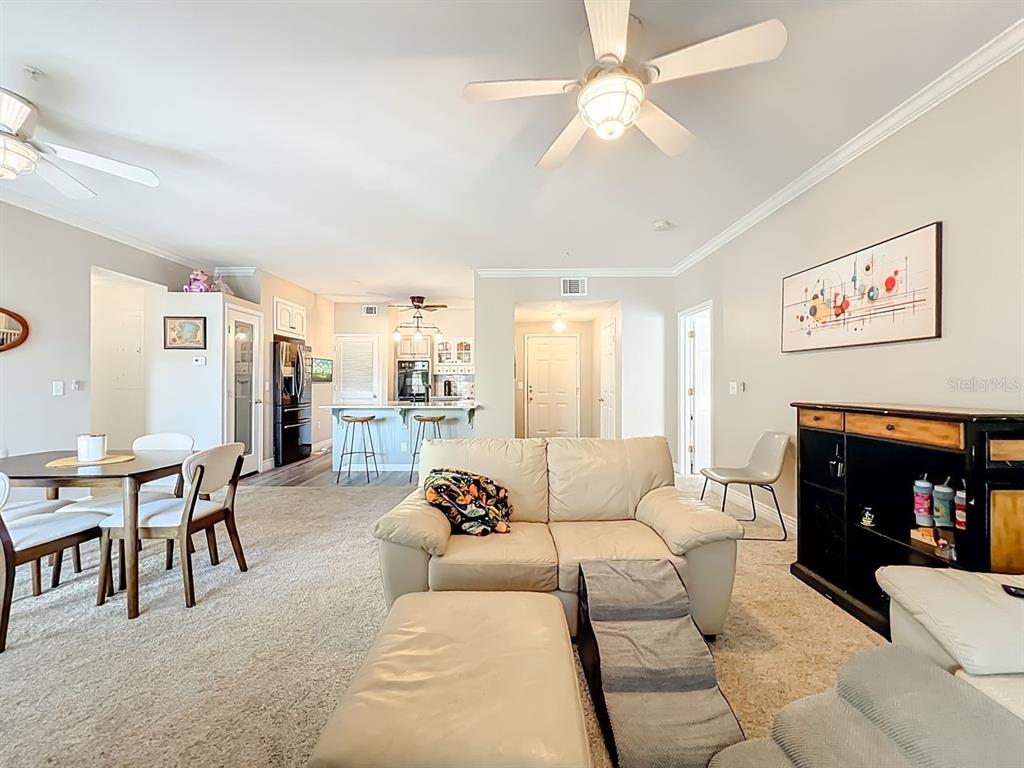 793 Celebration Avenue Celebration, FL 34747 - Photo 7 of 32 a living room with furniture and a fireplace