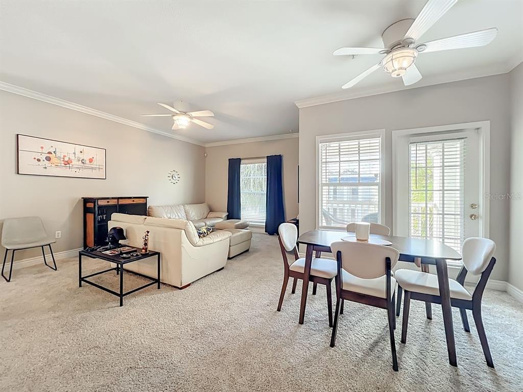 793 Celebration Avenue Celebration, FL 34747 - Photo 10 of 32 a living room with furniture and a window