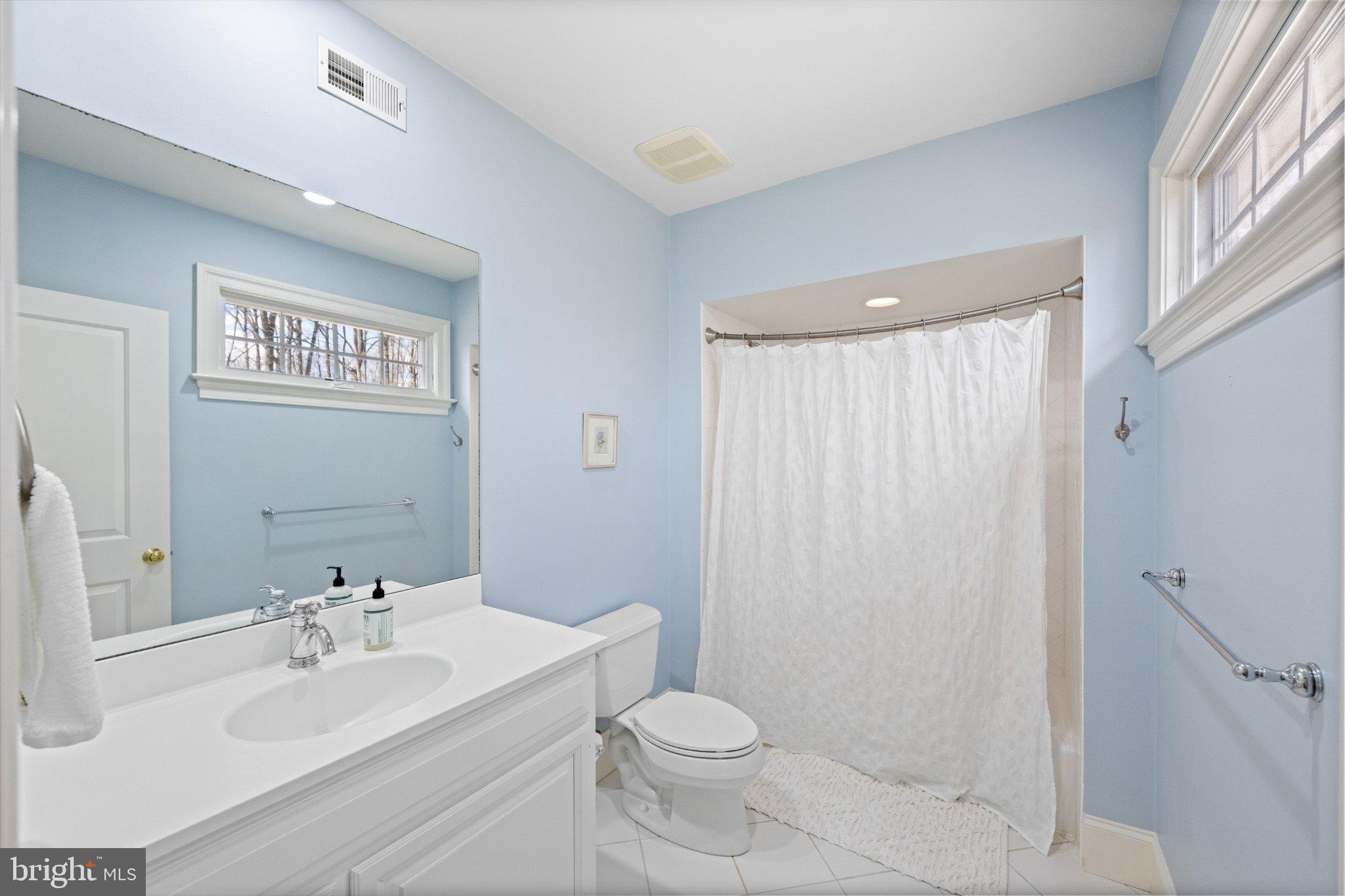 429 Church Road Devon, PA 19333 - Photo 34 of 55 Serene blue bathroom retreat.