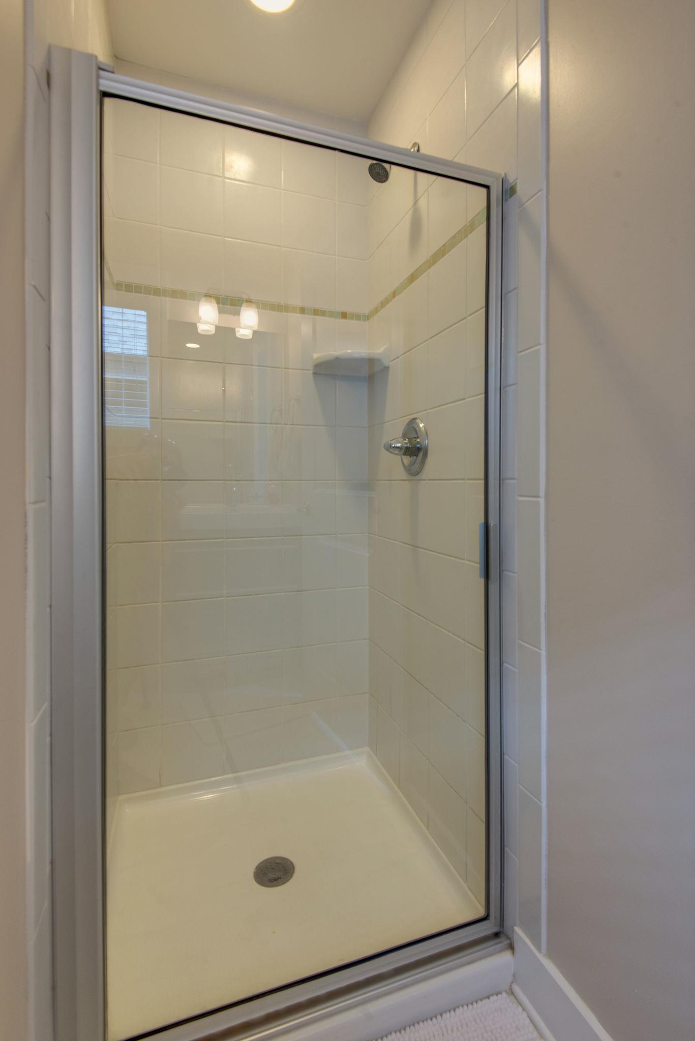 205 Copley Lane Nashville, TN 37204 - Photo 12 of 20 a bathroom with a glass shower door