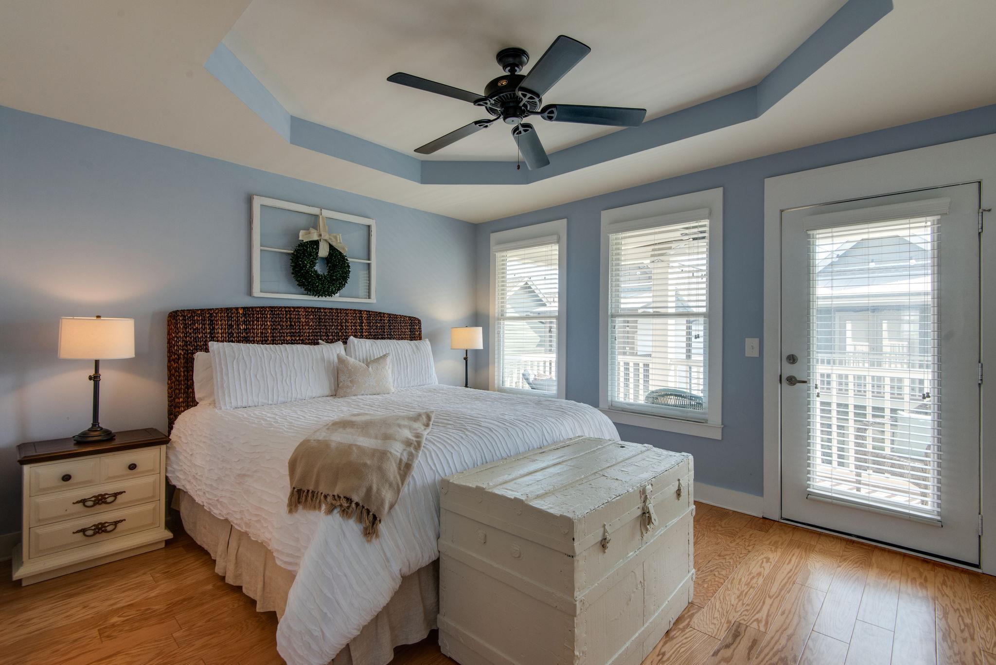 205 Copley Lane Nashville, TN 37204 - Photo 13 of 20 a spacious bedroom with a large bed and a chandelier