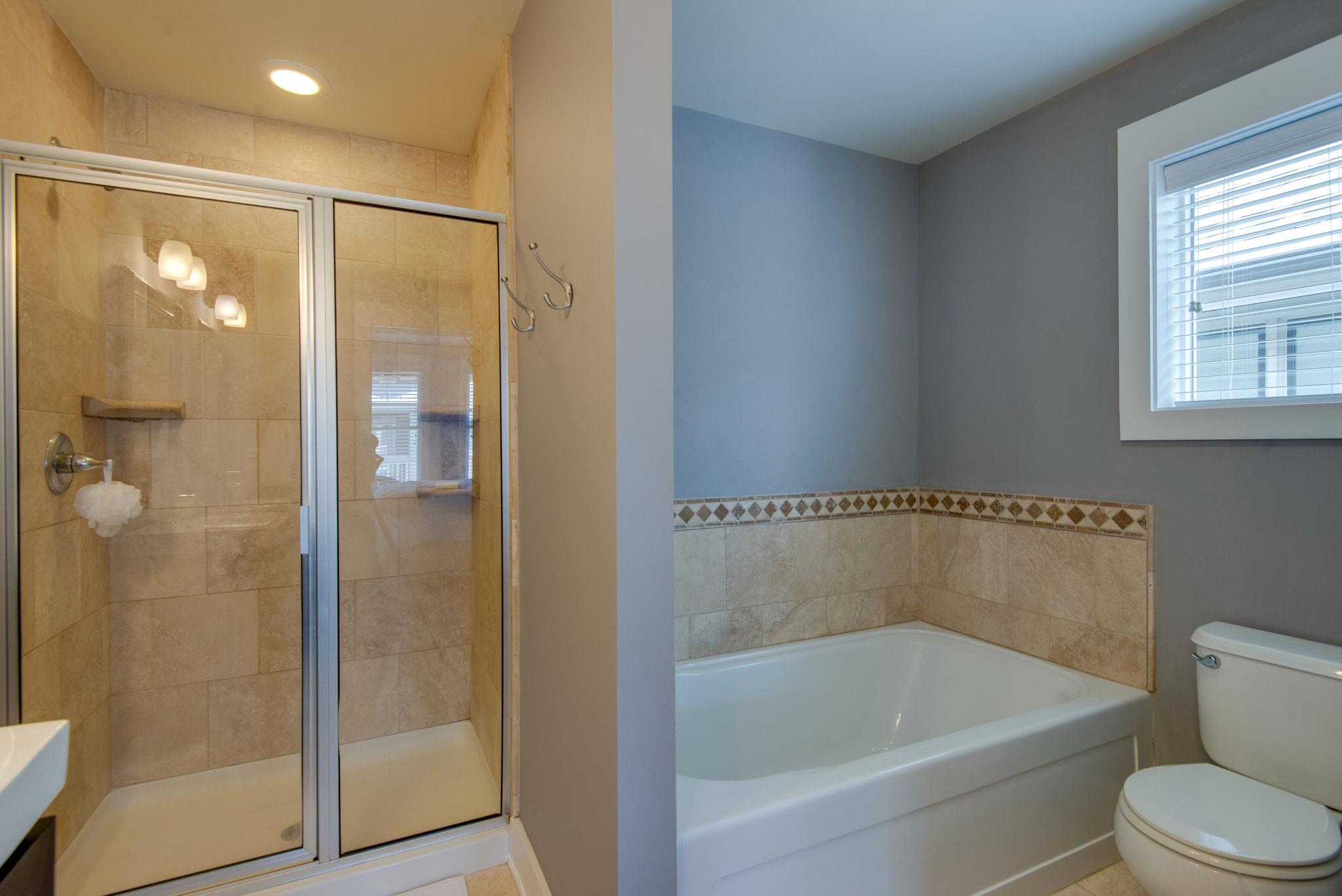 205 Copley Lane Nashville, TN 37204 - Photo 16 of 20 a bathroom with a bathtub and a shower