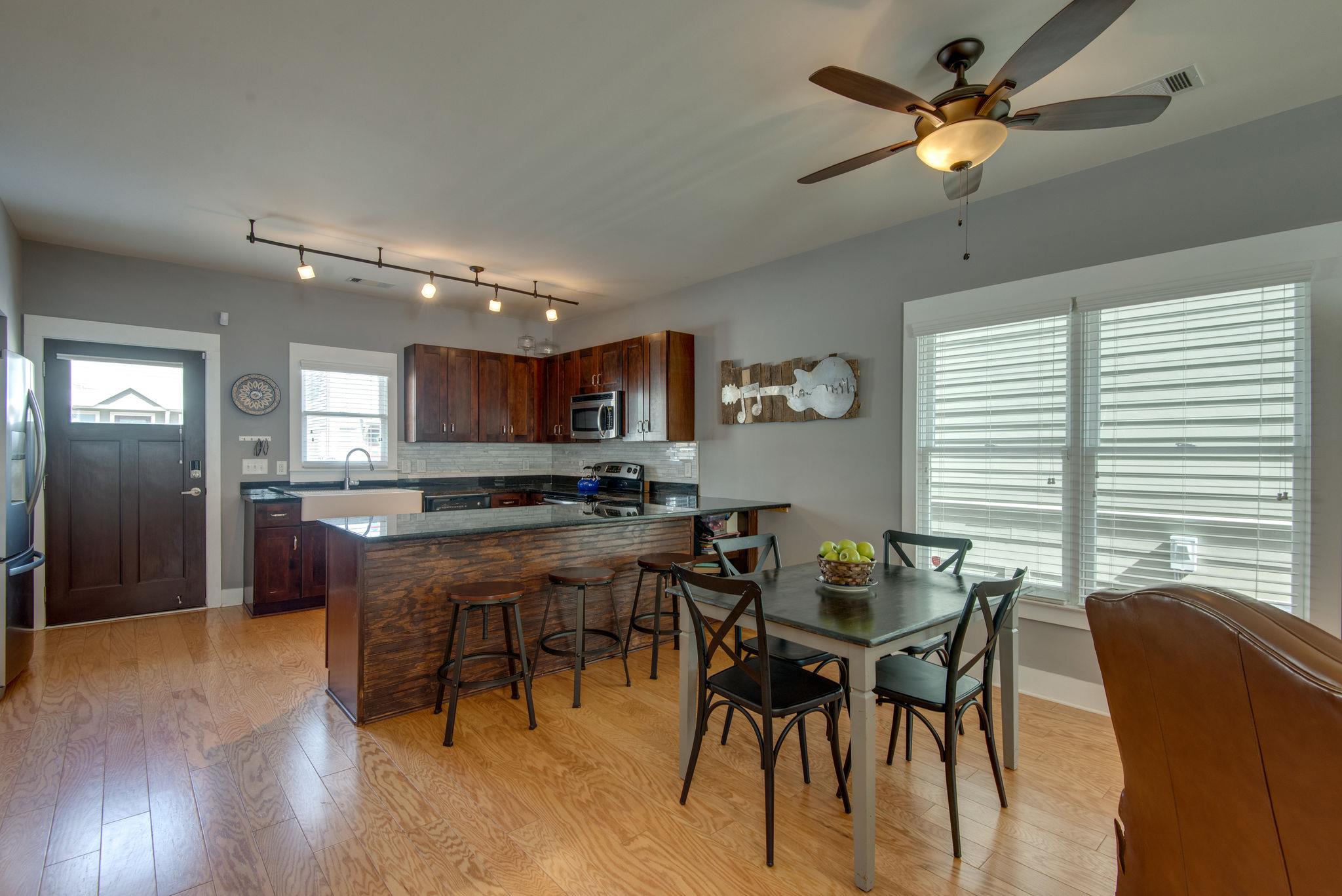 205 Copley Lane Nashville, TN 37204 - Photo 5 of 20 a view of a dining room with furniture window and wooden floor