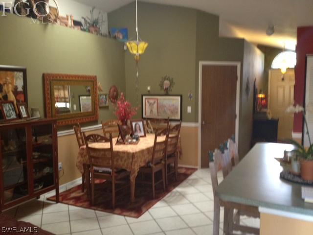 17409 Braddock Road Fort Myers, FL 33967 - Photo 8 of 18 a view of a dining room with furniture