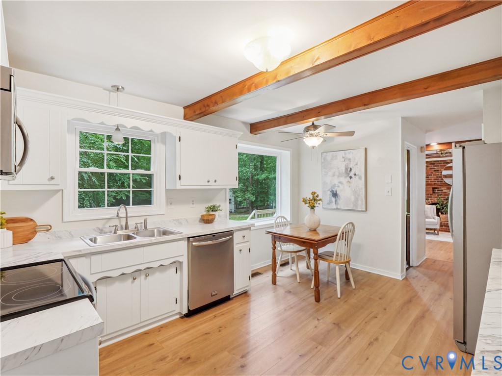 6530 Glebe Point Road Chesterfield, VA 23838 - Photo 13 of 41 a kitchen with a sink a window and chairs