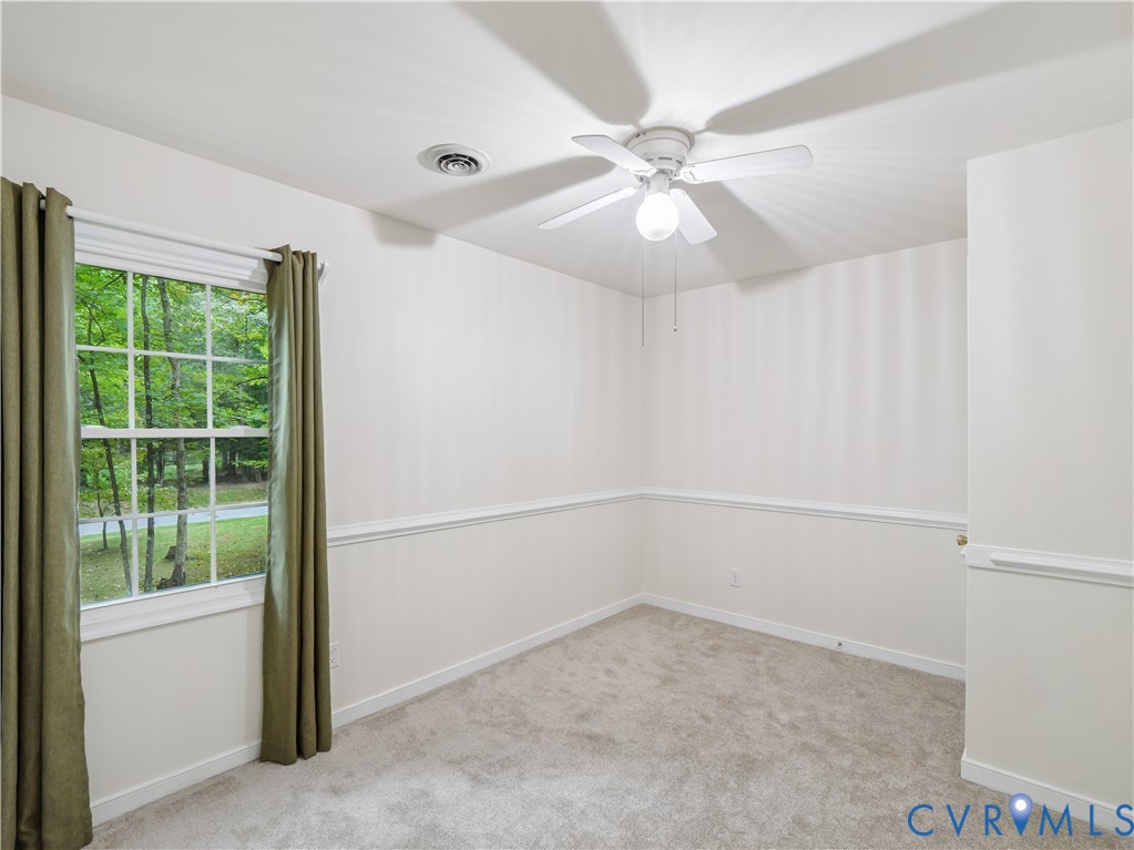 6530 Glebe Point Road Chesterfield, VA 23838 - Photo 30 of 41 an empty room with a window and a fan