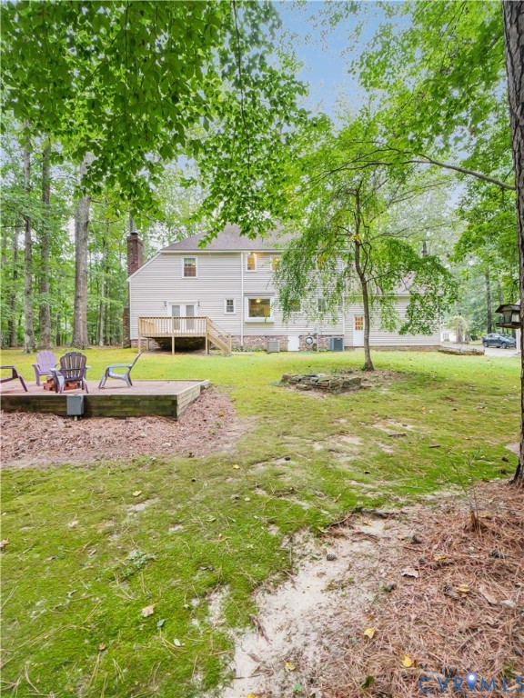 6530 Glebe Point Road Chesterfield, VA 23838 - Photo 33 of 41 a view of a patio with a table and chairs under an umbrella