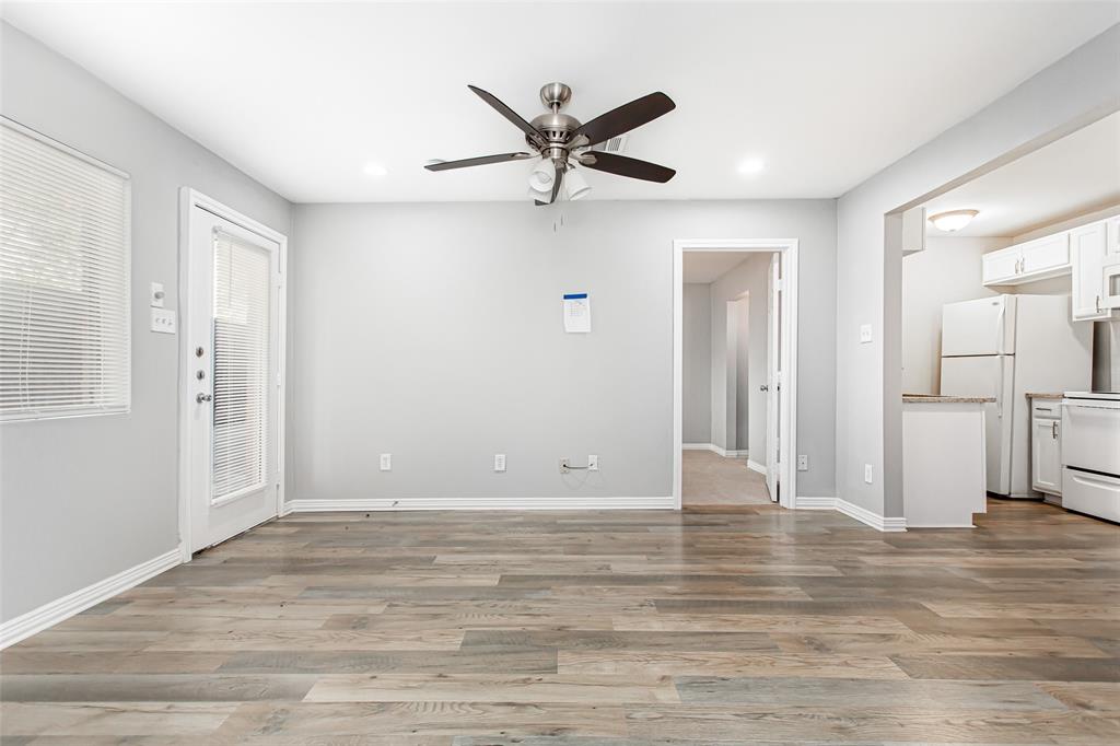 4931 Junius Street, Unit 4 Dallas, TX 75214 - Photo 11 of 31 a view of a livingroom with a ceiling fan & entryway