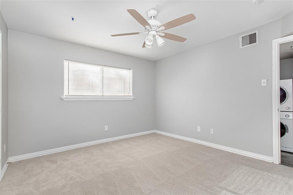 4931 Junius Street, Unit 4 Dallas, TX 75214 - Photo 23 of 31 an empty room with a window and a fan