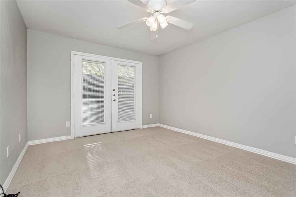 4931 Junius Street, Unit 4 Dallas, TX 75214 - Photo 24 of 31 an empty room with chandelier fan