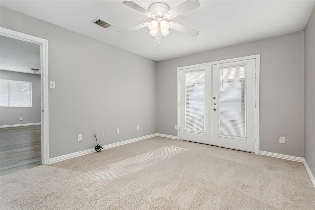 4931 Junius Street, Unit 4 Dallas, TX 75214 - Photo 28 of 31 an empty room with closet and a chandelier fan