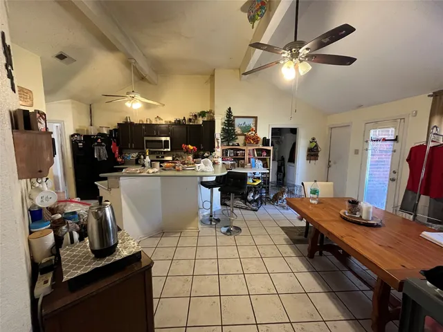 a room with gym equipment and a flat screen tv