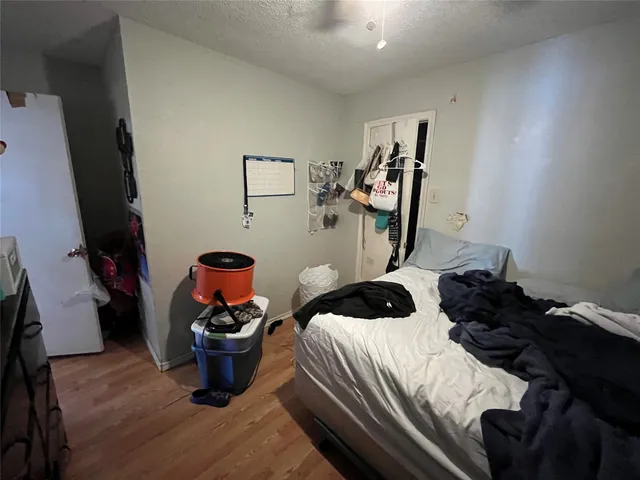 a bedroom with a bed and a walk in closet