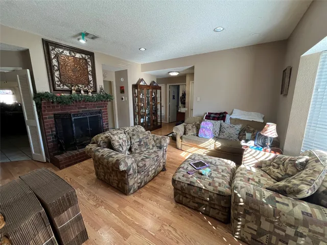 a bedroom with furniture and a fireplace