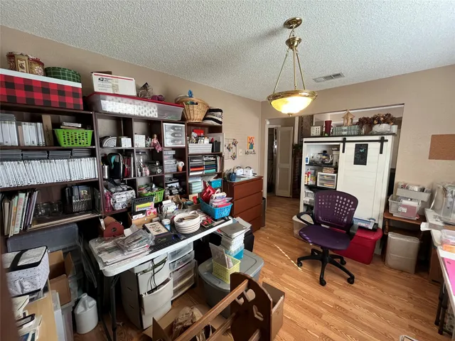 a living room with lots of furniture and a chandelier