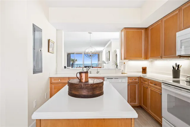 a kitchen with a sink a stove and cabinets