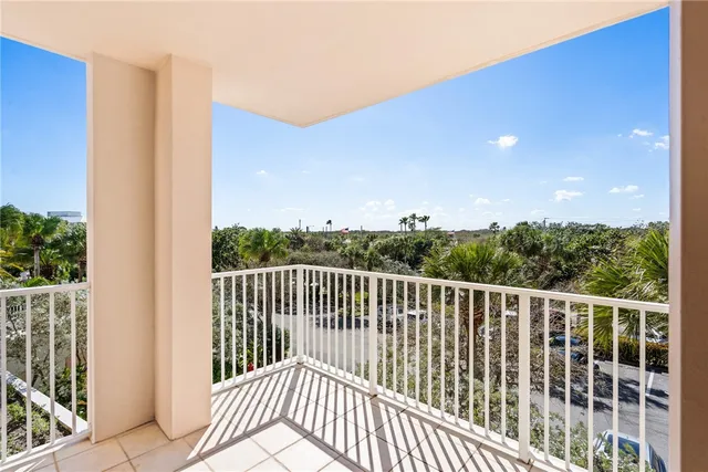 a view of a balcony with wooden floor