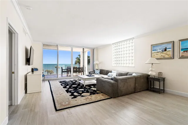 a living room with furniture rug and window