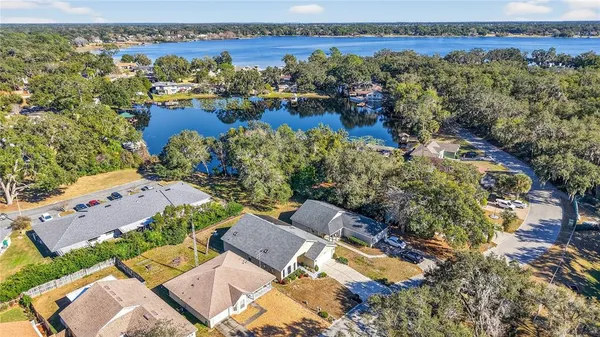 an aerial view of a house with a lake view