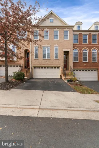 front view of a brick house with a street