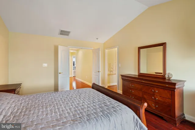 a bedroom with a bed and a dresser