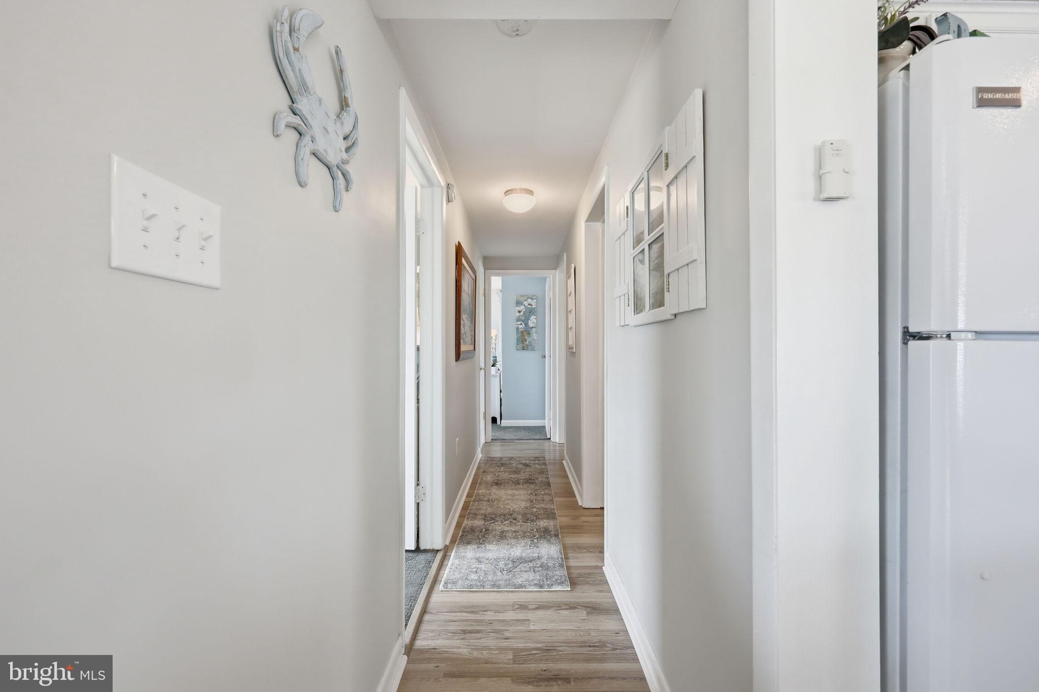 173 Cove Road Newport, NJ 08345 - Photo 19 of 72 a view of a hallway with wooden floor