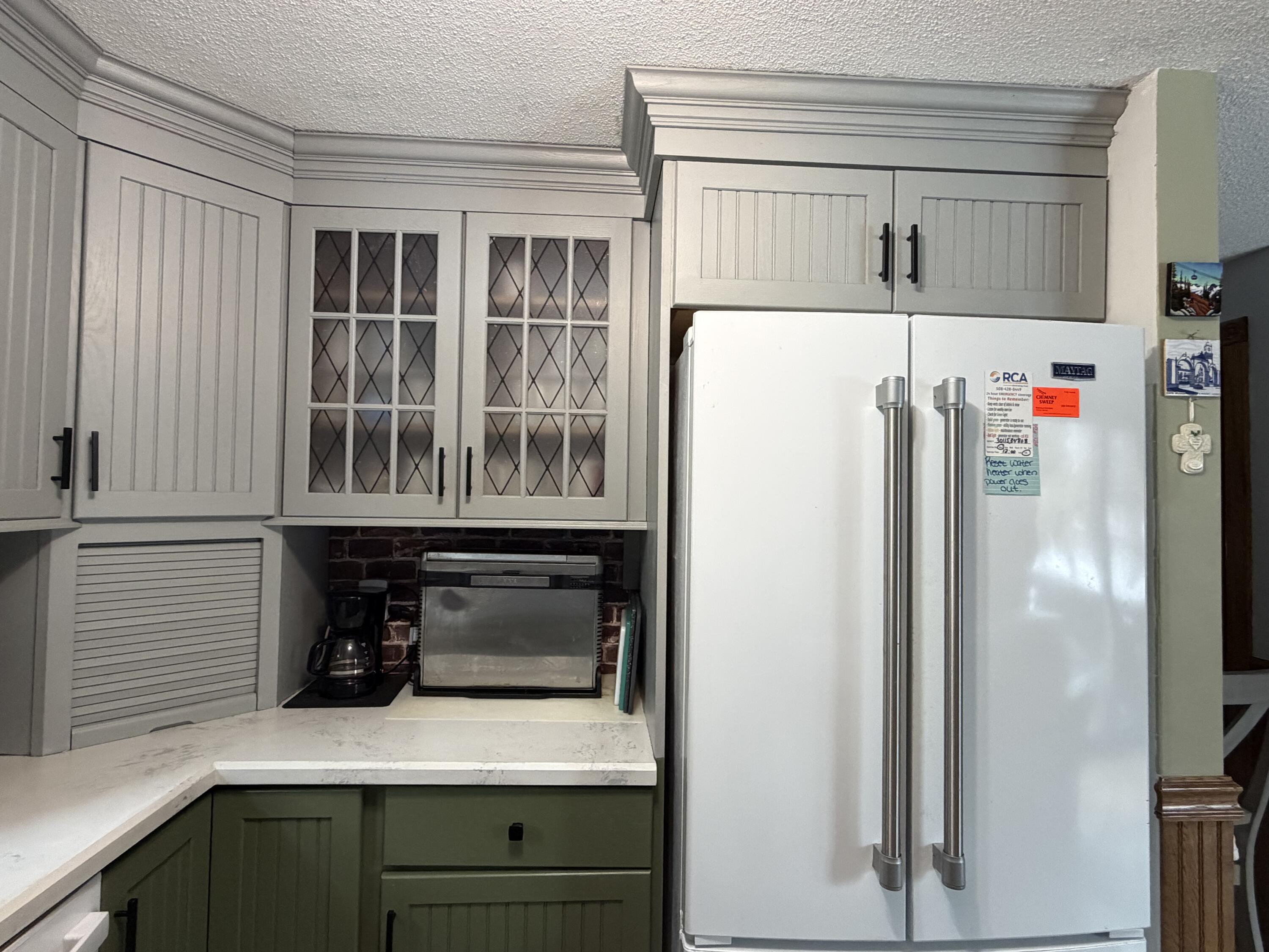 9 Bittersweet Road East Falmouth, MA 02536 - Photo 5 of 24 a white refrigerator freezer sitting inside of a kitchen