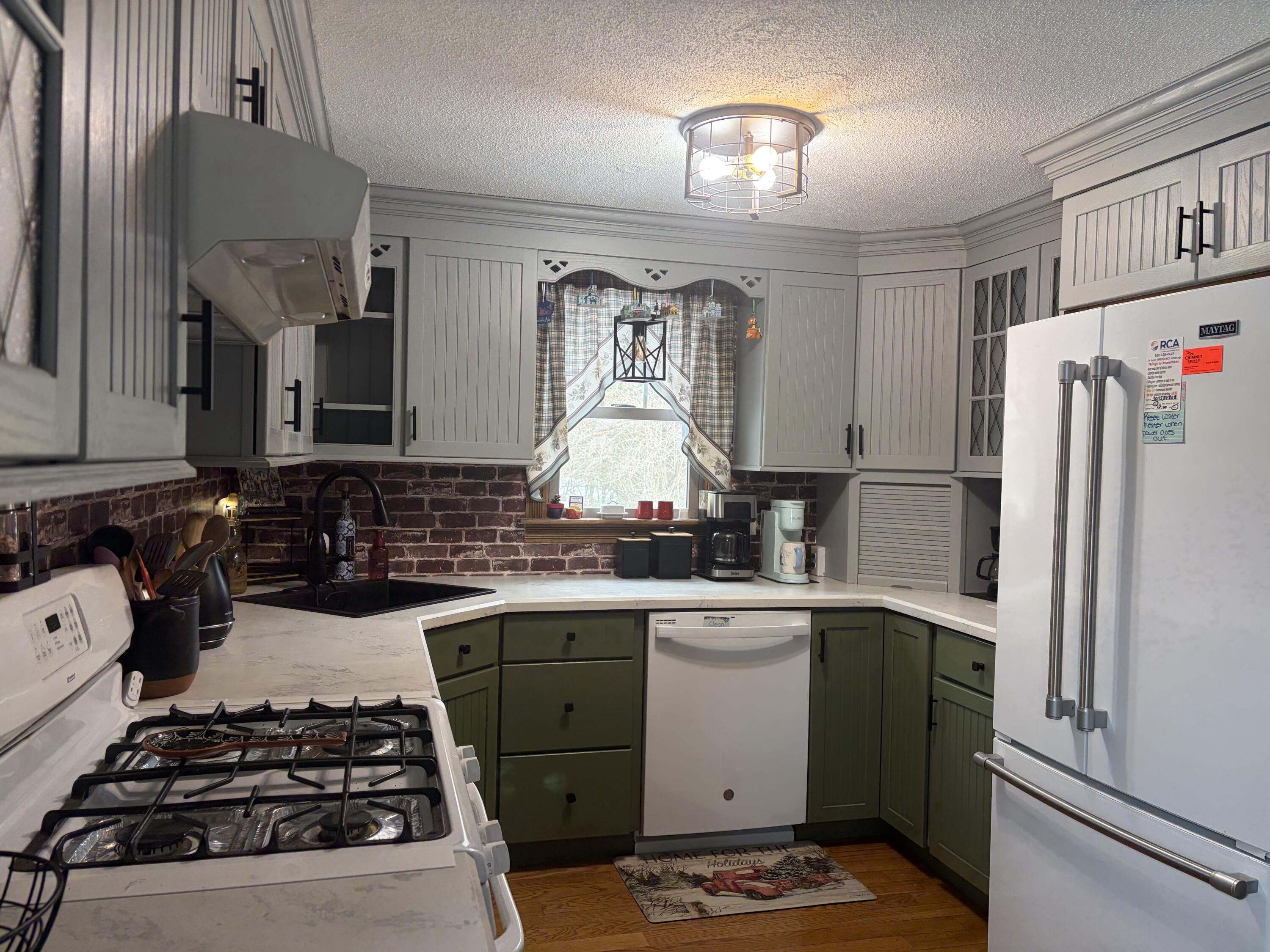 9 Bittersweet Road East Falmouth, MA 02536 - Photo 6 of 24 a kitchen with a stove and a refrigerator