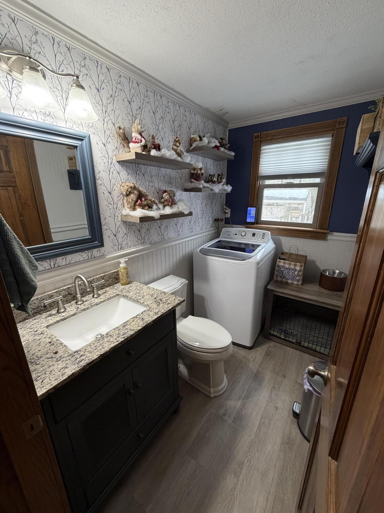 9 Bittersweet Road East Falmouth, MA 02536 - Photo 10 of 24 a bathroom with a toilet sink and mirror