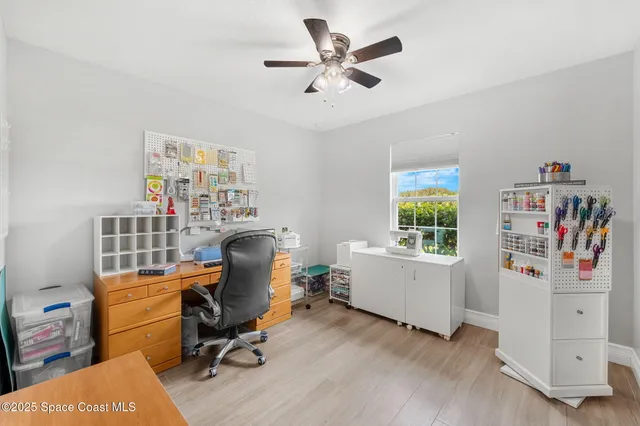 a bathroom with a granite countertop sink mirror and toilet