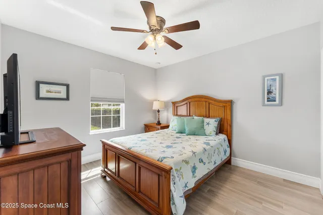a living room filled with furniture and a umbrella