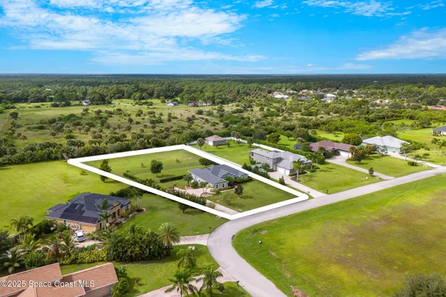 a view of a swimming pool with a yard
