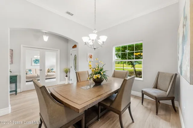 a living room with furniture and a lamp