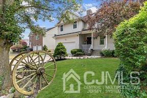 89 Elm Street Colonia, NJ 07067 - Photo 1 of 29 a view of backyard of house with outdoor seating and green space