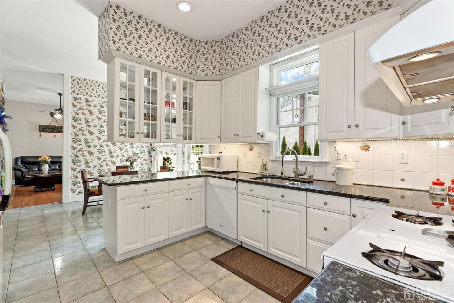 89 Elm Street Colonia, NJ 07067 - Photo 12 of 29 a kitchen with sink cabinets and stove