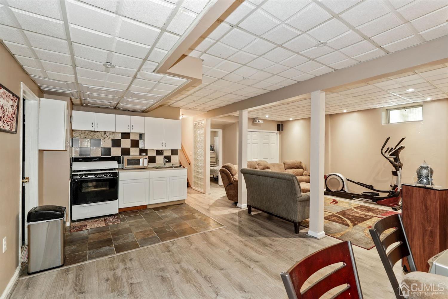 89 Elm Street Colonia, NJ 07067 - Photo 25 of 29 a kitchen with a sink appliances and cabinets