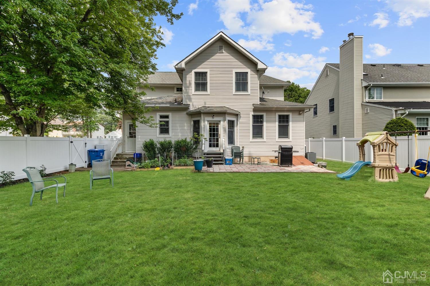 89 Elm Street Colonia, NJ 07067 - Photo 27 of 29 a front view of house with yard and outdoor seating