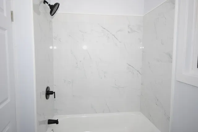 a bathroom with a bathtub