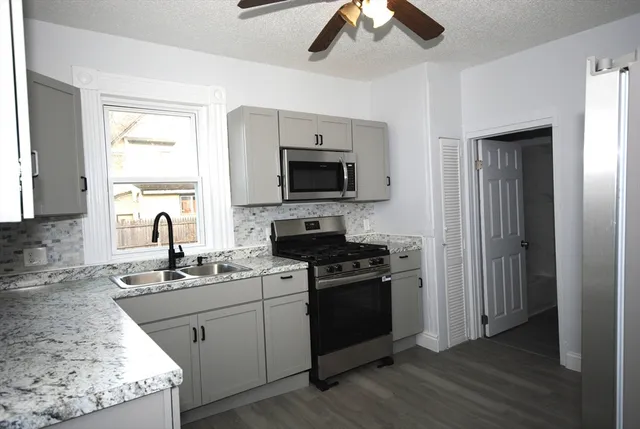 a kitchen with a stove and a sink