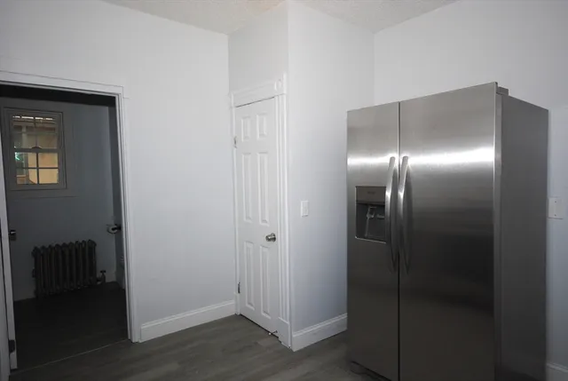 a bathroom with a glass shower door