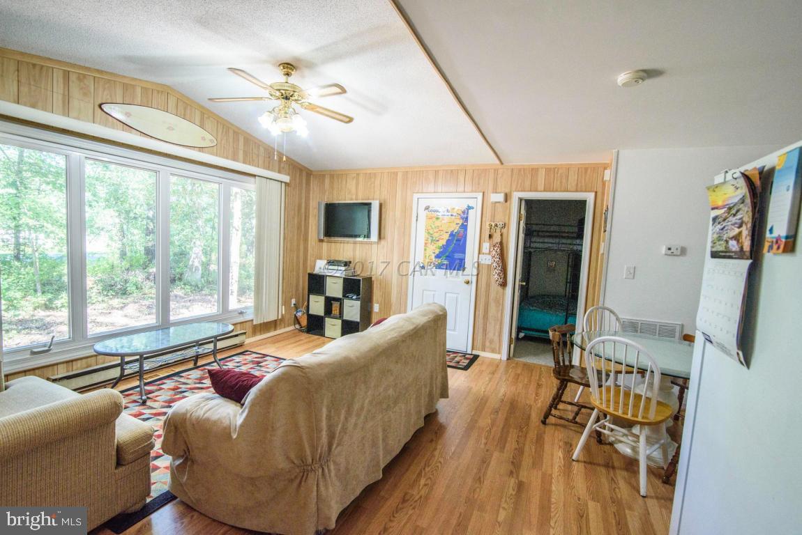 125 Pinehurst Road Ocean Pines, MD 21811 - Photo 2 of 49 a living room with furniture and a large window