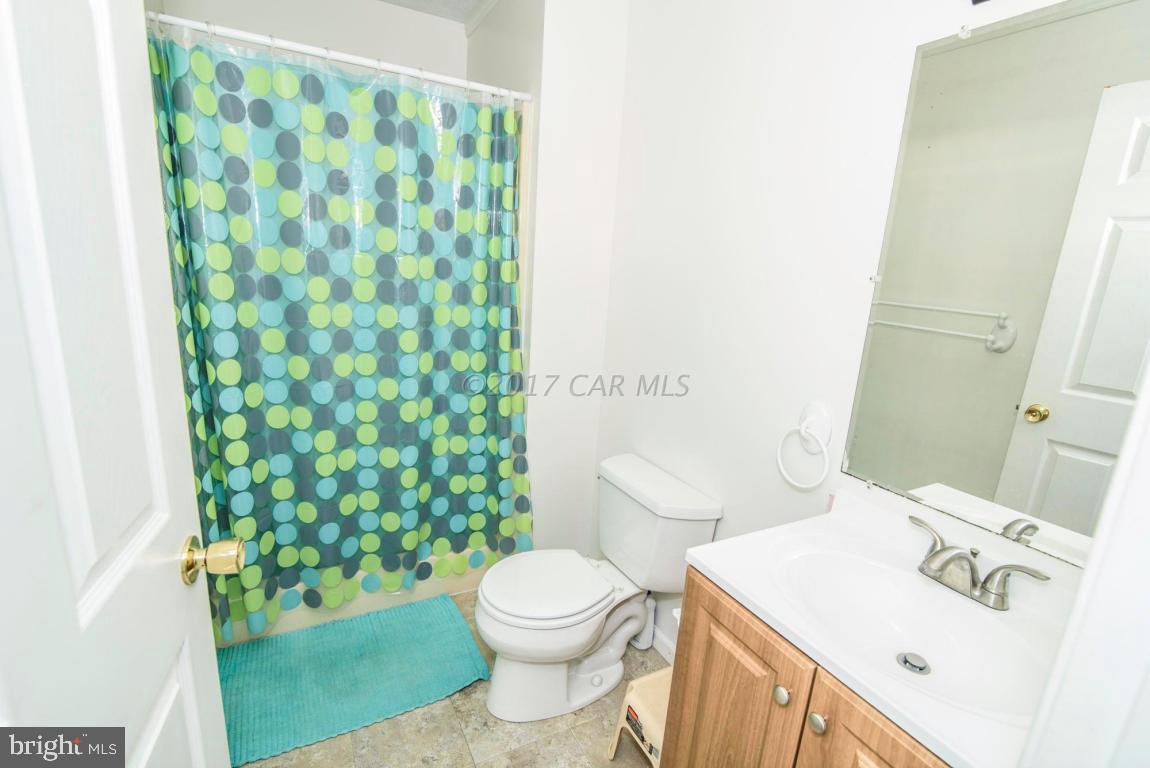 125 Pinehurst Road Ocean Pines, MD 21811 - Photo 13 of 49 a bathroom with a sink and a toilet