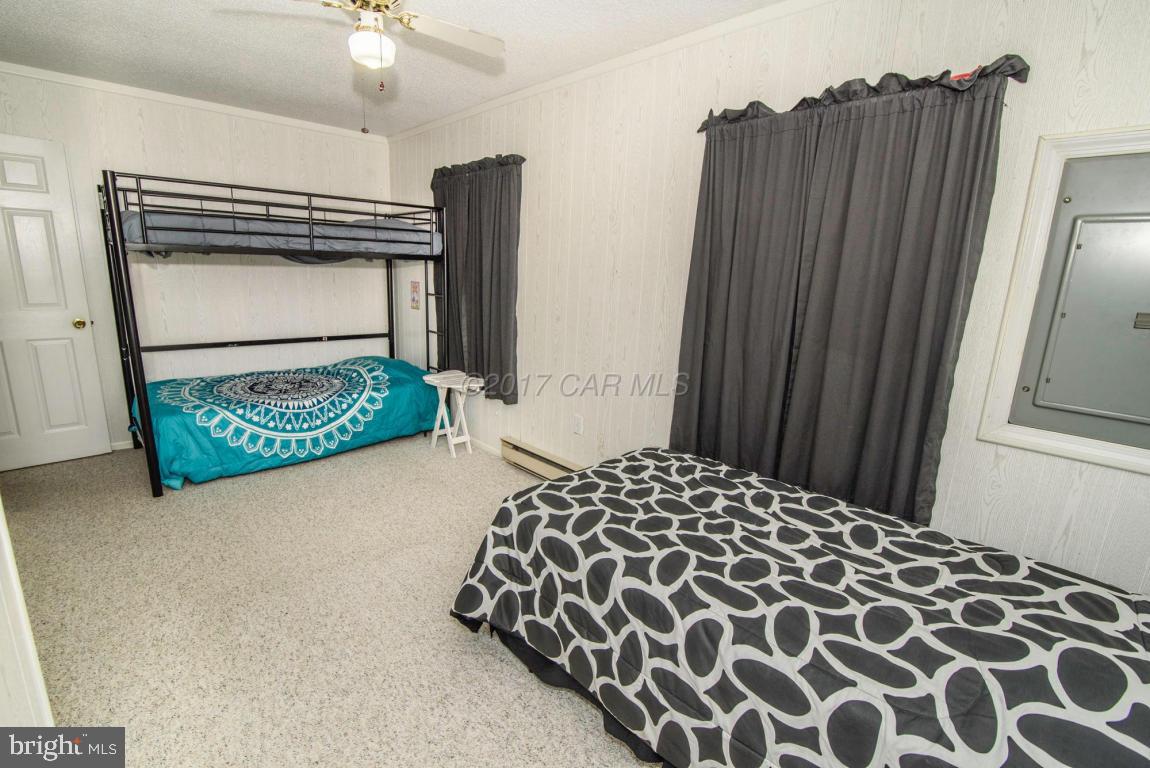 125 Pinehurst Road Ocean Pines, MD 21811 - Photo 16 of 49 a bedroom with a bed and a dresser