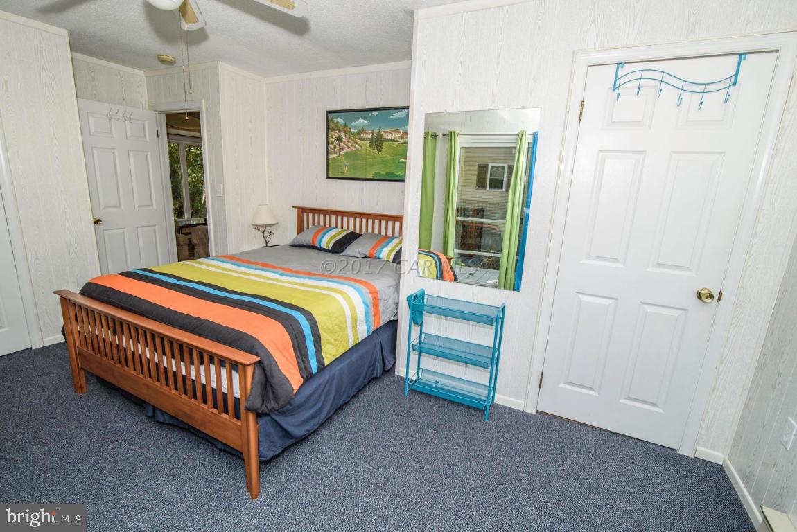 125 Pinehurst Road Ocean Pines, MD 21811 - Photo 25 of 49 a bedroom with a bed and a window
