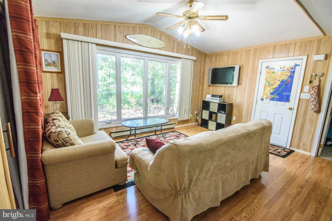 125 Pinehurst Road Ocean Pines, MD 21811 - Photo 31 of 49 a living room with furniture and a large window