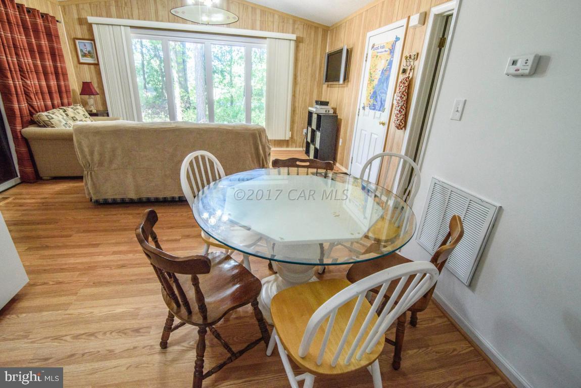 125 Pinehurst Road Ocean Pines, MD 21811 - Photo 34 of 49 a view of a dining room with furniture window and wooden floor