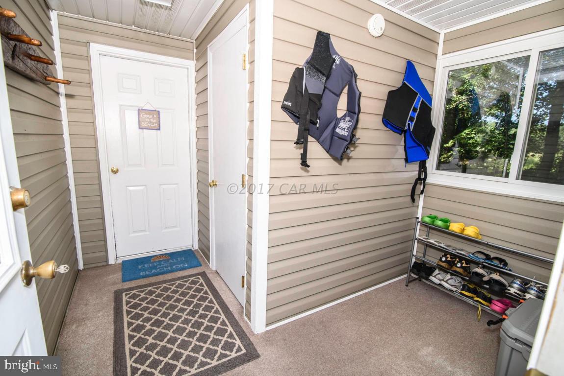 125 Pinehurst Road Ocean Pines, MD 21811 - Photo 39 of 49 a view of walk in closet with clothes and shoes