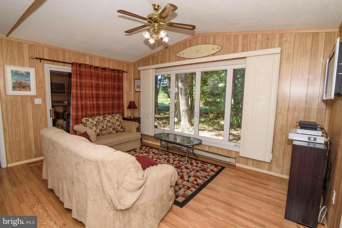 125 Pinehurst Road Ocean Pines, MD 21811 - Photo 5 of 49 a living room with furniture and a large window