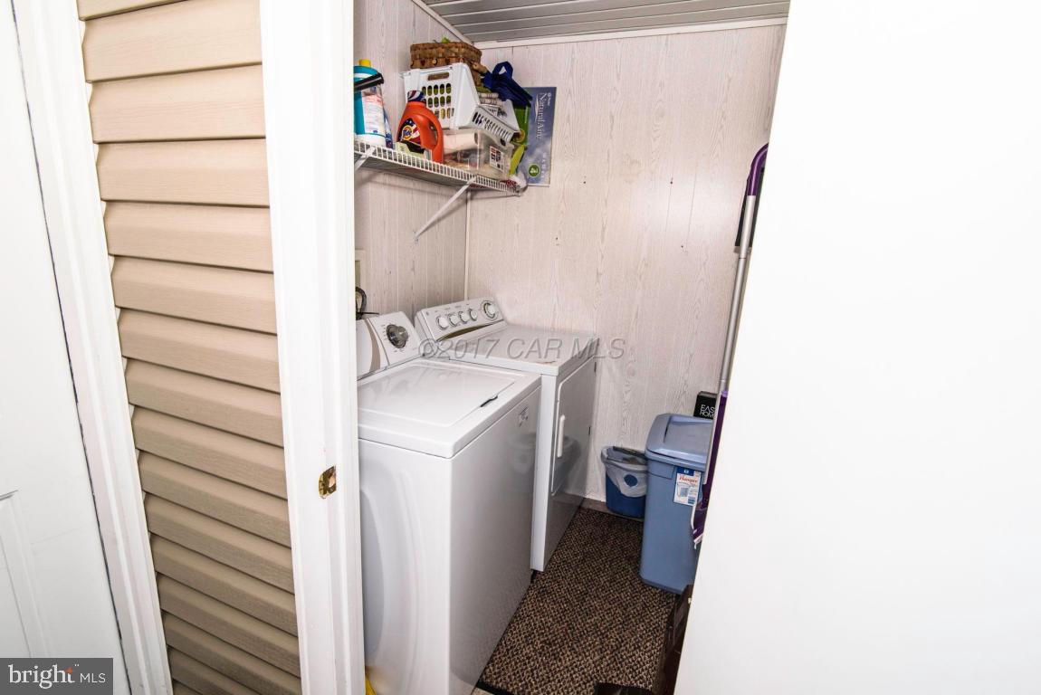 125 Pinehurst Road Ocean Pines, MD 21811 - Photo 41 of 49 a utility room with a sink washer and dryer