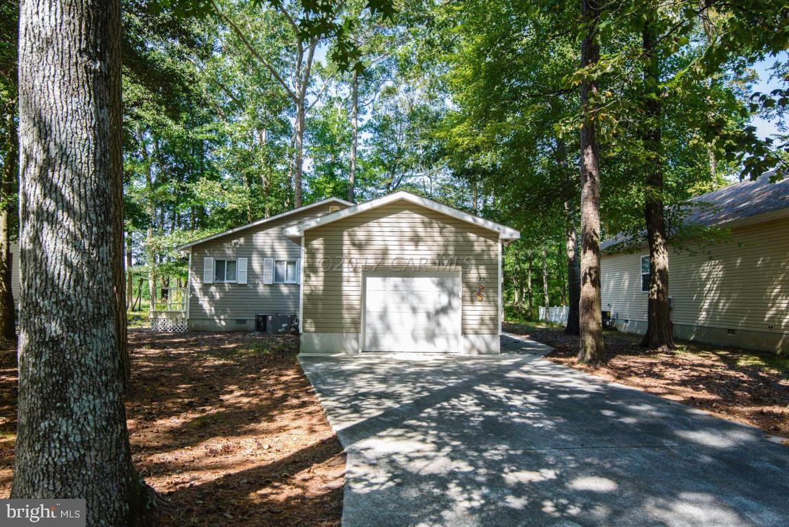 125 Pinehurst Road Ocean Pines, MD 21811 - Photo 44 of 49 a view of a house with a yard